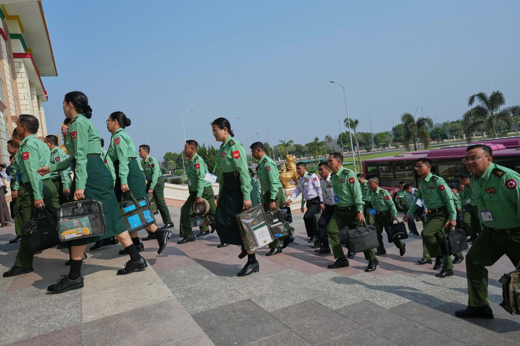CORRECTS THE YEAR - Myanmar's military representatives arrive to attend for a session at Lower House parliament in Naypyitaw, Myanmar, Monday, March 16, 2026. (AP Photo/Aung Shine Oo)