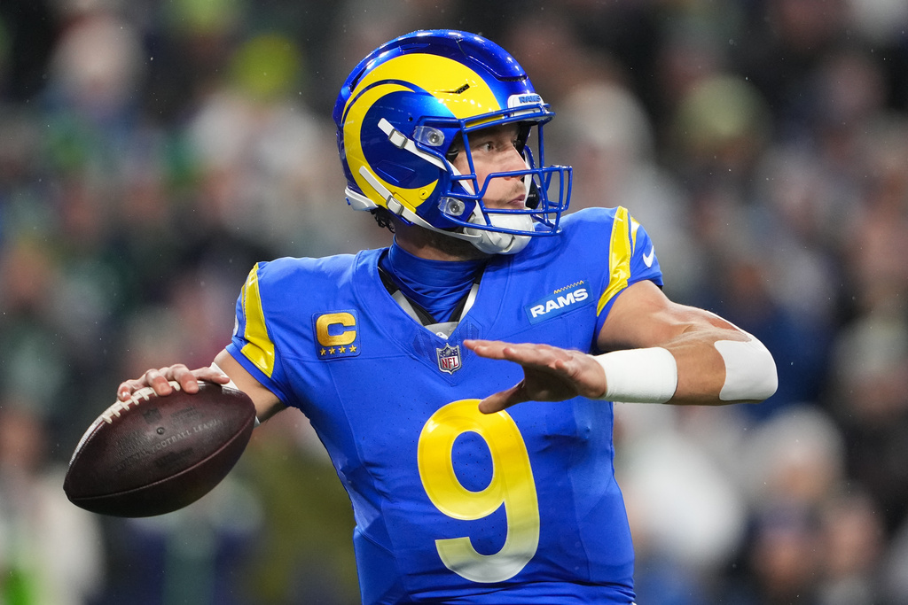 Los Angeles Rams quarterback Matthew Stafford prepares to throw during the first half of an NFL football game against the Seattle Seahawks, Thursday, Dec. 18, 2025, in Seattle. (AP Photo/Lindsey Wasson)