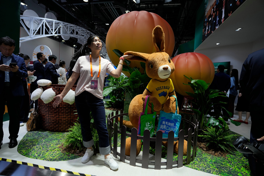 FILE - A visitor poses with a kangaroo mascot at the Australian booth during the China International Fair for Trade in Services (CIFTIS) held in Beijing, China, on Wednesday, Sept. 10, 2025. (AP Photo/Ng Han Guan), File)