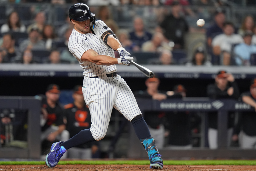 New York Yankees' Giancarlo Stanton hits a two-run home run during the third inning of a baseball game against the Baltimore Orioles Friday, Sept. 26, 2025, in New York. (AP Photo/Frank Franklin II)