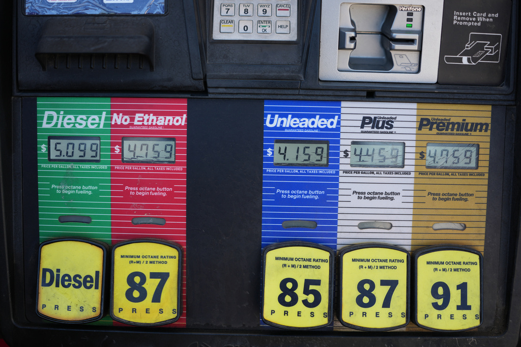 The per-gallon price is displayed electronically over the various grades of fuel available from a pump at a QT gasoline station Thursday, July 30, 2026, in Greenwood Village, Colo. (AP Photo/David Zalubowski)