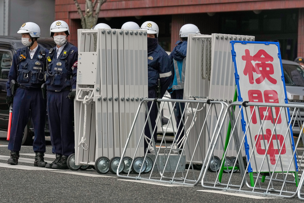 Police officers stand guard at a check point at a street near the venue where Japanese Prime Minister Sanae Takaichi and South Korean President Lee Jae Myung hold the meeting Tuesday, Jan. 13, 2026, in Nara, western Japan. (AP Photo/Eugene Hoshiko)