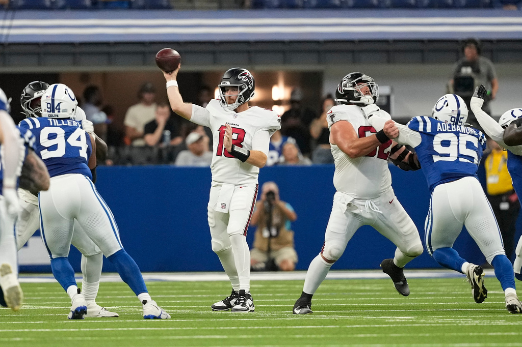 Atlanta Falcons quarterback Cooper Rush (13) throws against the Indianapolis Colts during the first half of an NFL football game in Indianapolis, Saturday, Aug. 22, 2026. (AP Photo/Nam Y. Huh)