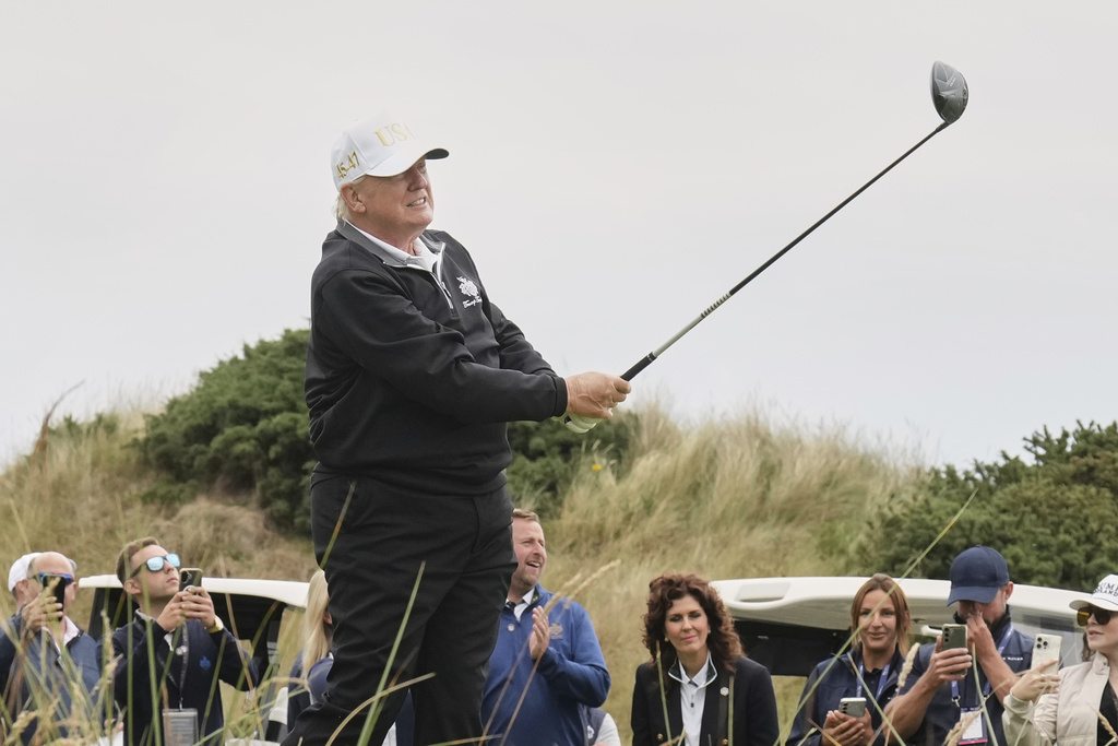 United States President Donald Trump tees off during the opening ceremony for the Trump International Golf Links golf course, near Aberdeen, Scotland, July 29, 2025. (AP Photo/Jacquelyn Martin, File)
