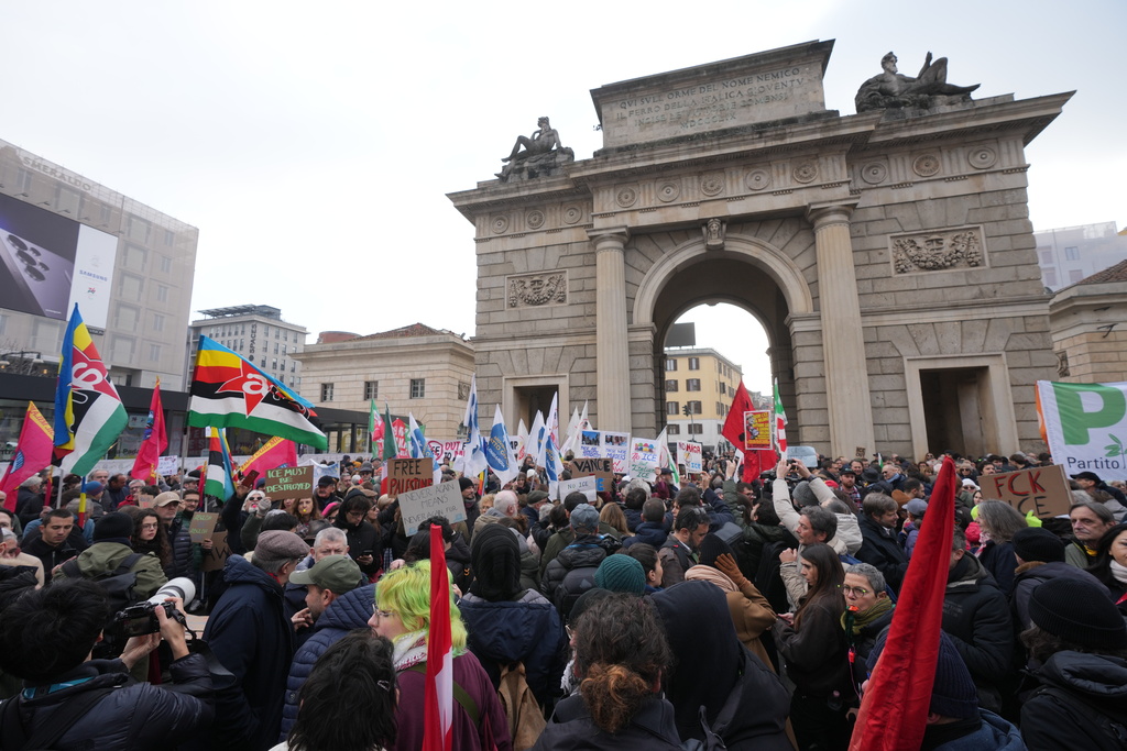 People take part in an Anti-ICE demonstration, ahead of the 2026 Winter Olympics, in Milan, Italy, Saturday, Jan. 31, 2026. (AP Photo/Antonio Calanni)