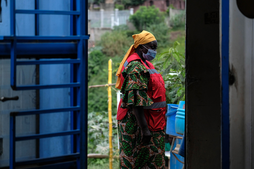 A health worker walks at a temporary health clinic at the Mpondwe border crossing linking Uganda and the Democratic Republic of the Congo, Thursday, June 4, 2026. (AP Photo/Hajarah Nalwadda)
