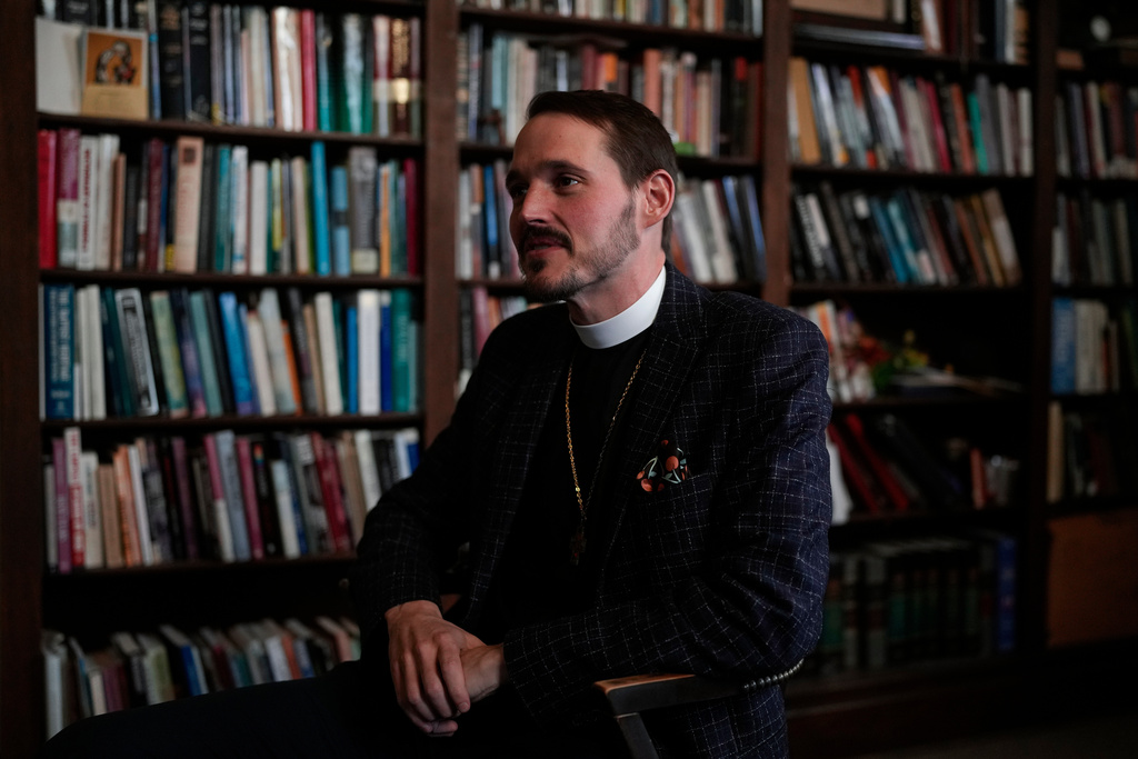 The Rev. Dr. Michael Woolf sits in his office at Lake Street Church of Evanston, Wednesday, Dec. 10, 2025, in Evanston, Ill. (AP Photo/Erin Hooley)