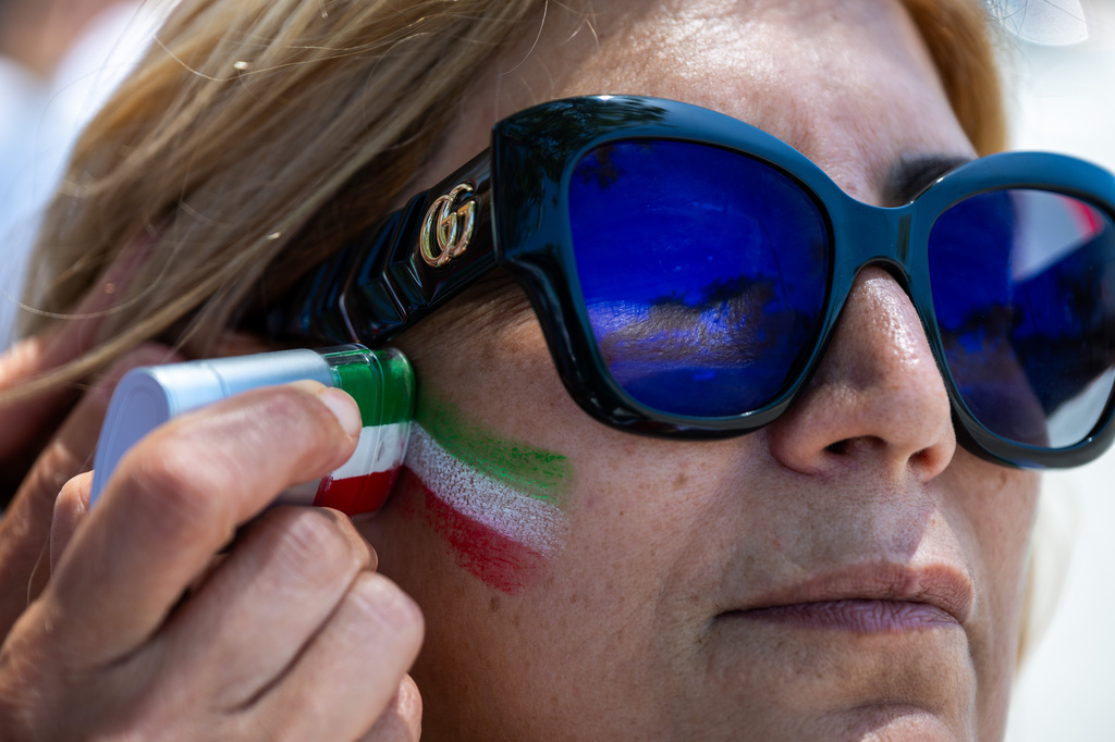 A woman has her face painted during a protest in reaction to FIFA's ban of Iran's pre-revolutionary flag inside World Cup stadiums Sunday, June 7, 2026, in Inglewood, Calif. (AP Photo/Benjamin Hanson)