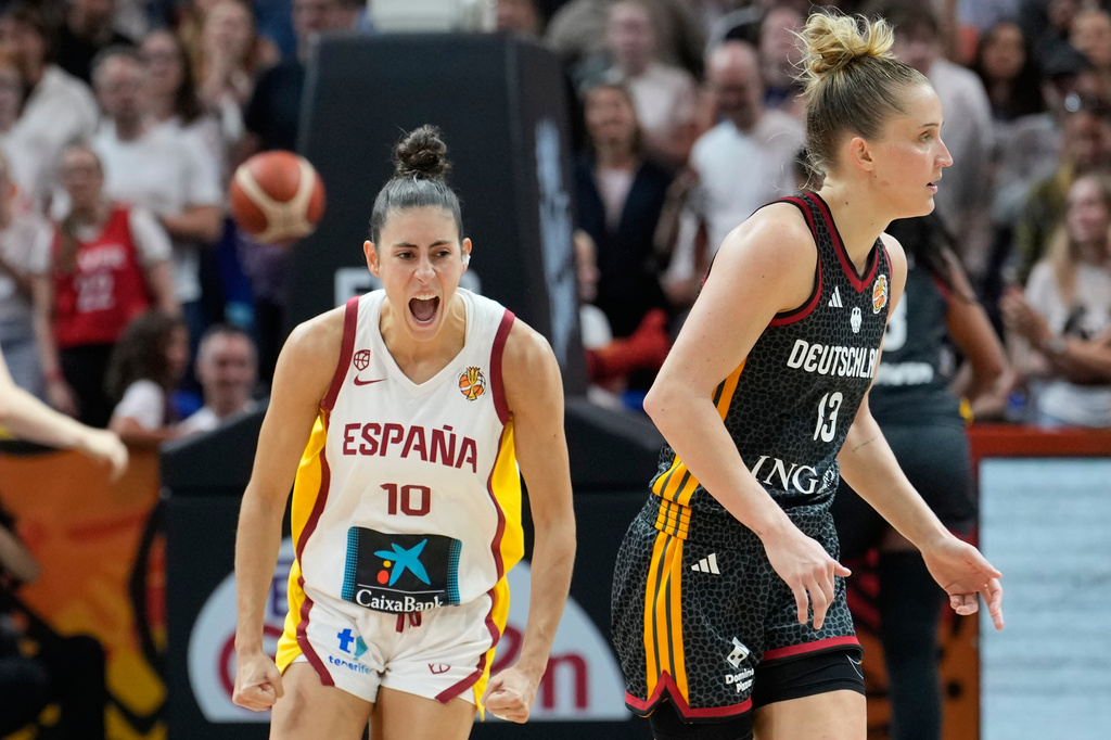 Spain's Maite Cazorla and Iyana Martín hug during the Women's Basketball World Cup the third-place match between the Germany and Spain in Berlin, Sunday, Sept. 13, 2026. (AP Photo/Ebrahim Noroozi)