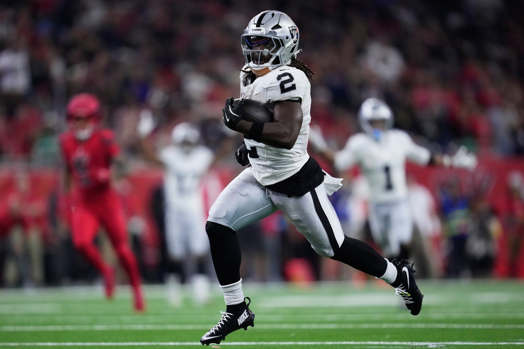 Las Vegas Raiders running back Ashton Jeanty (2) runs for a touchdown during the second half of an NFL football game against the Houston Texans, Sunday, Dec. 21, 2025, in Houston. (AP Photo/Ashley Landis)