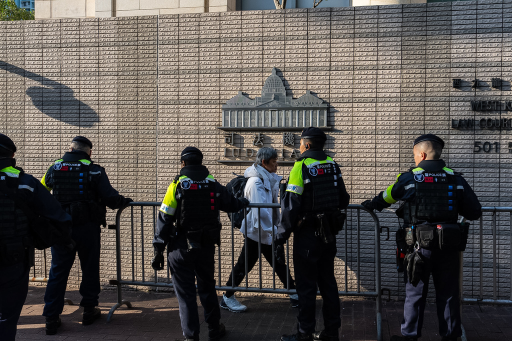 Police officers stand guard outside the West Kowloon Magistrates' Courts ahead of the sentencing of Hong Kong activist publisher Jimmy Lai in Hong Kong, Monday, Feb. 9, 2026. (AP Photo/Chan Long Hei)