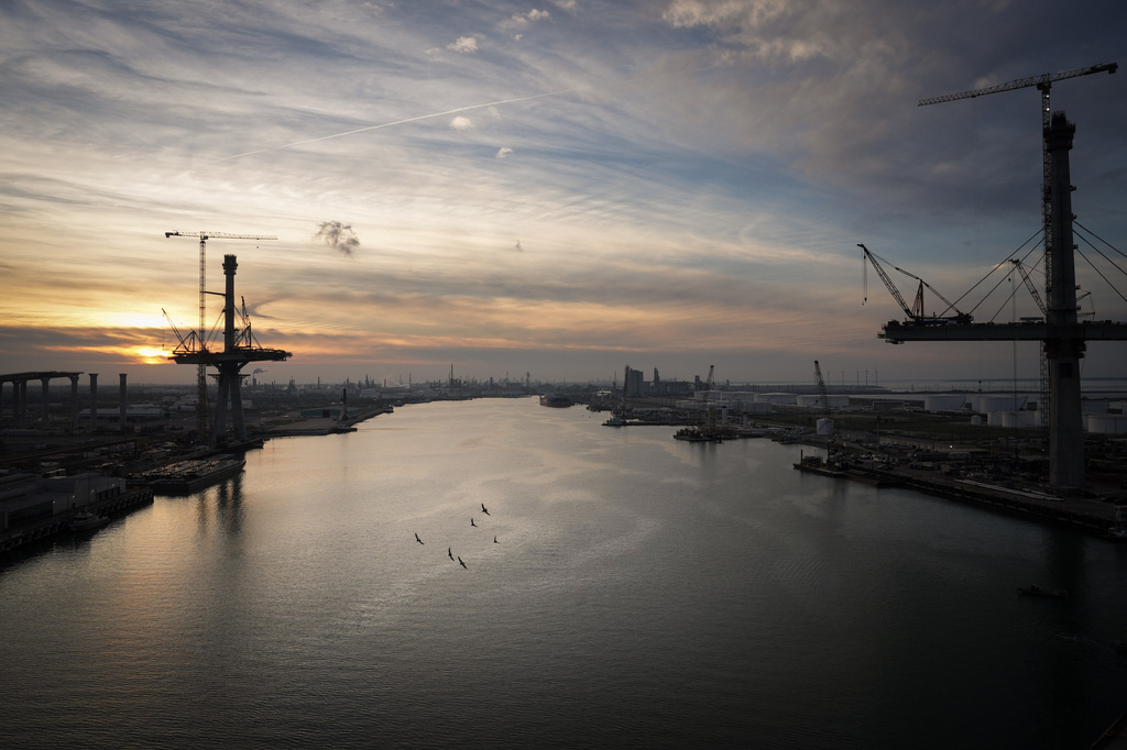 Birds fly over the Port of Corpus Christi as the sun sets Thursday, Nov. 16, 2023, in Corpus Christi, Texas. (Jon Shapley/Houston Chronicle via AP)
