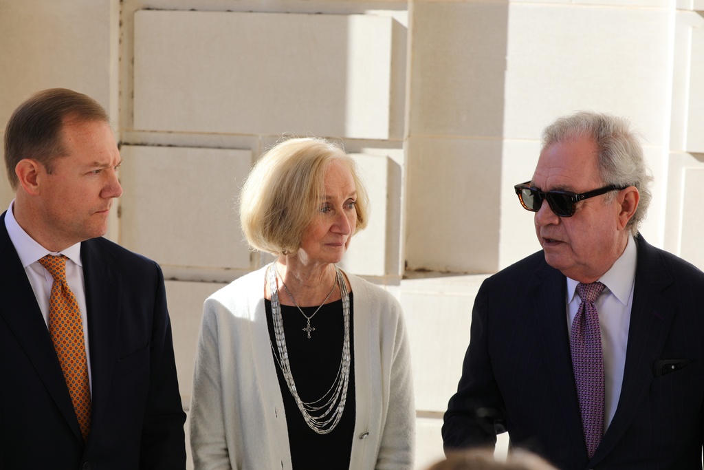 From left to right, Republican South Carolina Sen. Wes Climer, York County resident Carol Herring, and attorney Dick Harpootlian talk about their case suing the state General Assembly over a pay raise outside the South Carolina Supreme Court building in Columbia, S.C., on Wednesday, Oct. 22, 2025.. (AP Photo/Jeffrey Collins)
