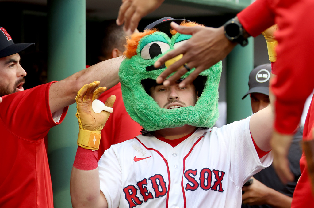 Boston Red Sox's Caleb Durbin celebrates in the dugout after his solo home run during the second inning of a baseball game against the Kansas City Royals, Sunday, Sept. 13, 2026, in Boston. (AP Photo/Mark Stockwell)