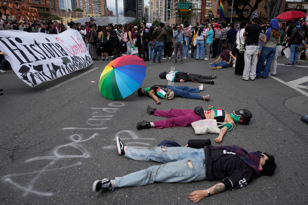 Demonstrators protest against President Abelardo de la Espriella's order to remove exhibits about political violence from the National Museum in Bogota, Colombia, Saturday, Oct. 17, 2026. (AP Photo/Fernando Vergara)