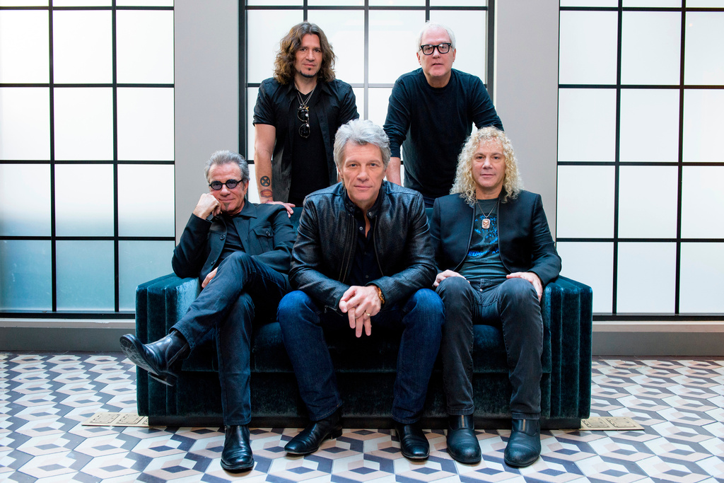 FILE - Members of Bon Jovi front row from left, Tico Torres, Jon Bon Jovi, David Bryan, back row from left, Phil X, and Hugh McDonald pose for a portrait in New York on Oct. 19, 2016. (Photo by Drew Gurian/Invision/AP, File)
