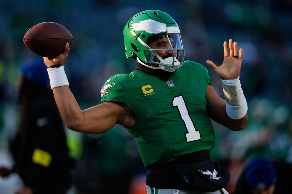 Philadelphia Eagles quarterback Jalen Hurts warms up before an NFL football game against the Washington Commanders on Sunday, Jan. 4, 2026, in Philadelphia. (AP Photo/Chris Szagola)