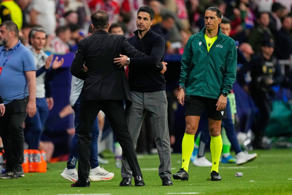 Atletico Madrid's head coach Diego Simeone, left, greets Arsenal's manager Mikel Arteta after a Champions League semifinal, first leg, soccer match between Atletico Madrid and Arsenal in Madrid, Spain, Wednesday, April 29, 2026. (AP Photo/Jose Breton)