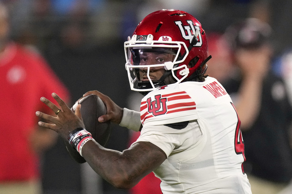 Utah quarterback Devon Dampier passes during the first half of an NCAA college football game against UCLA, Saturday, Aug. 30, 2025, in Pasadena, Calif. (AP Photo/Mark J. Terrill)