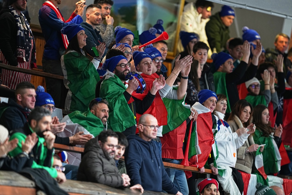 Italy fans watch the men's curling round robin session against Britain, at the 2026 Winter Olympics, in Cortina d'Ampezzo, Italy, Friday, Feb. 13, 2026. (AP Photo/Fatima Shbair)