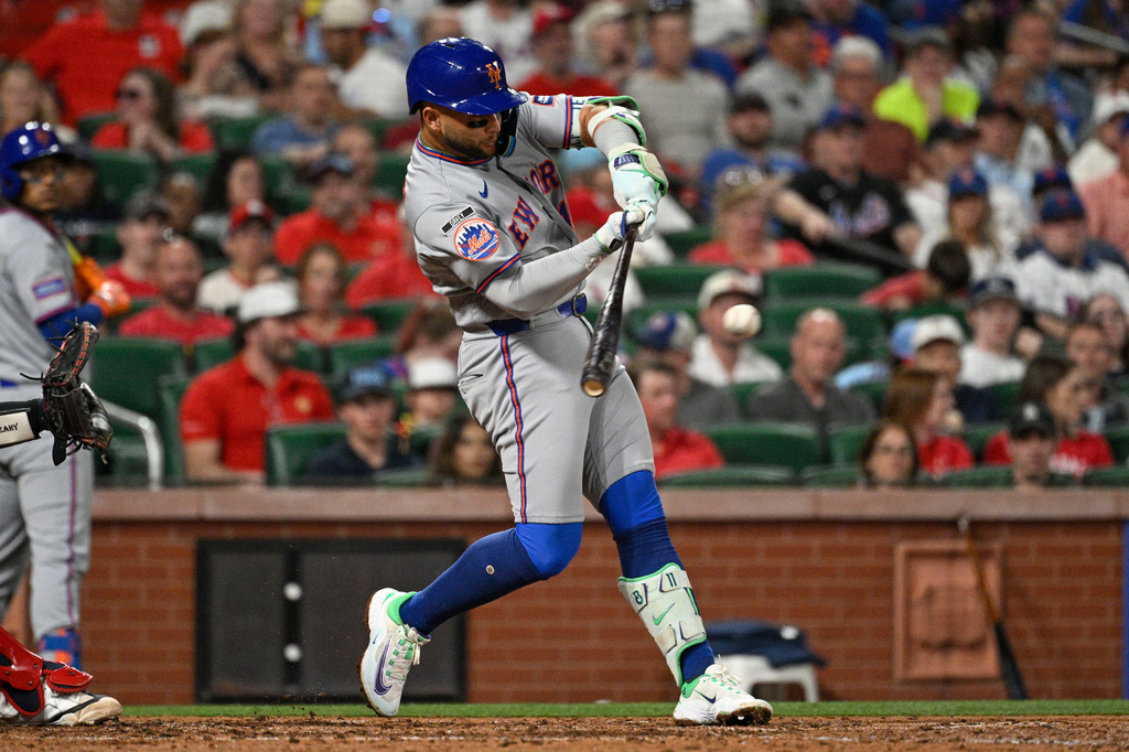 New York Mets' Bo Bichette hits an RBI single in the fifth inning of a baseball game against the St. Louis Cardinals, Monday, March 30, 2026, in St. Louis. (AP Photo/Joe Puetz)