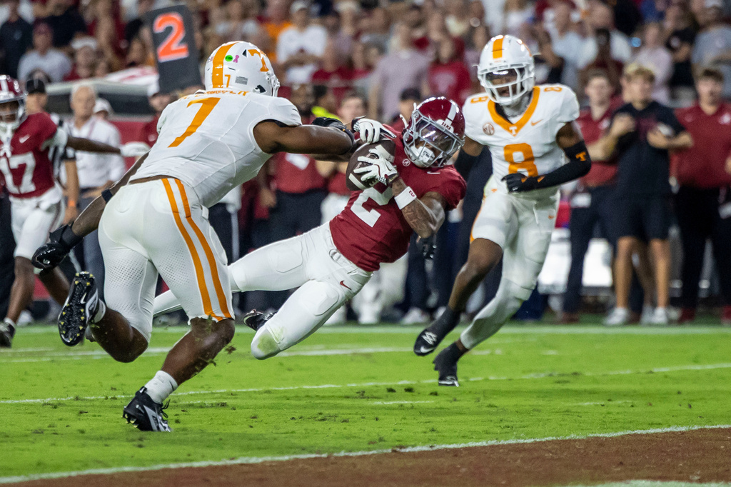 FILE - Alabama wide receiver Ryan Williams (2) grabs a pass in front of Tennessee linebacker Arion Carter (7) during the first half of an NCAA college football game, Oct. 18, 2025, in Tuscaloosa, Ala. (AP Photo/Vasha Hunt, File)
