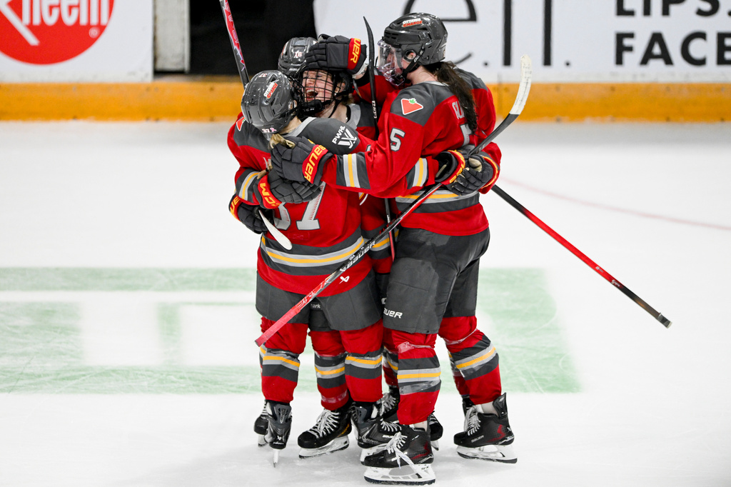 Ottawa Charge's Alexa Vasko, center, celebrates with teammates after her empty-net goal against the Toronto Sceptres during third-period PWHL hockey game action in Ottawa, Ontario, Saturday, April 25, 2026. (Spencer Colby/The Canadian Press via AP)