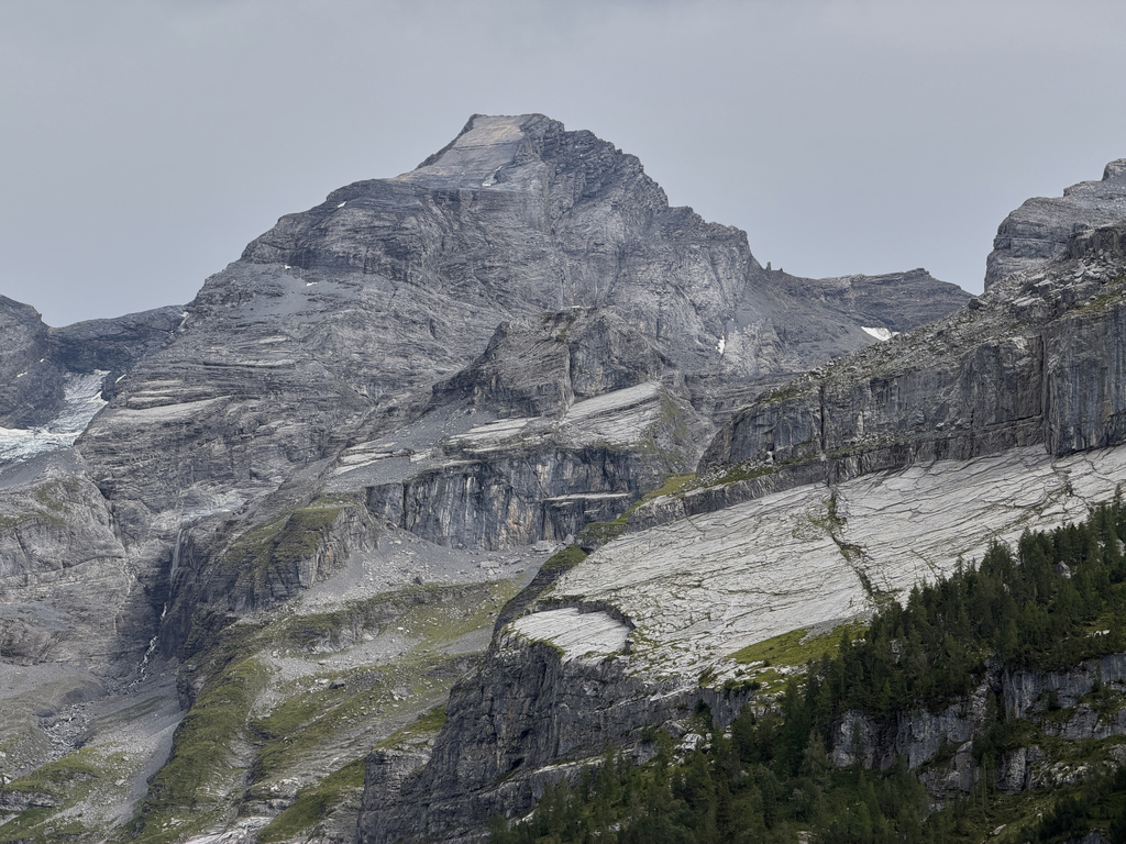 The "Spitze Stei" rock massive with the Bluemlisalphorn peak in the background seen over the Oeschinensee near Kandersteg, Switzerland, Tuesday, Aug. 4, 2026. (AP Photo/Hernan Munoz)