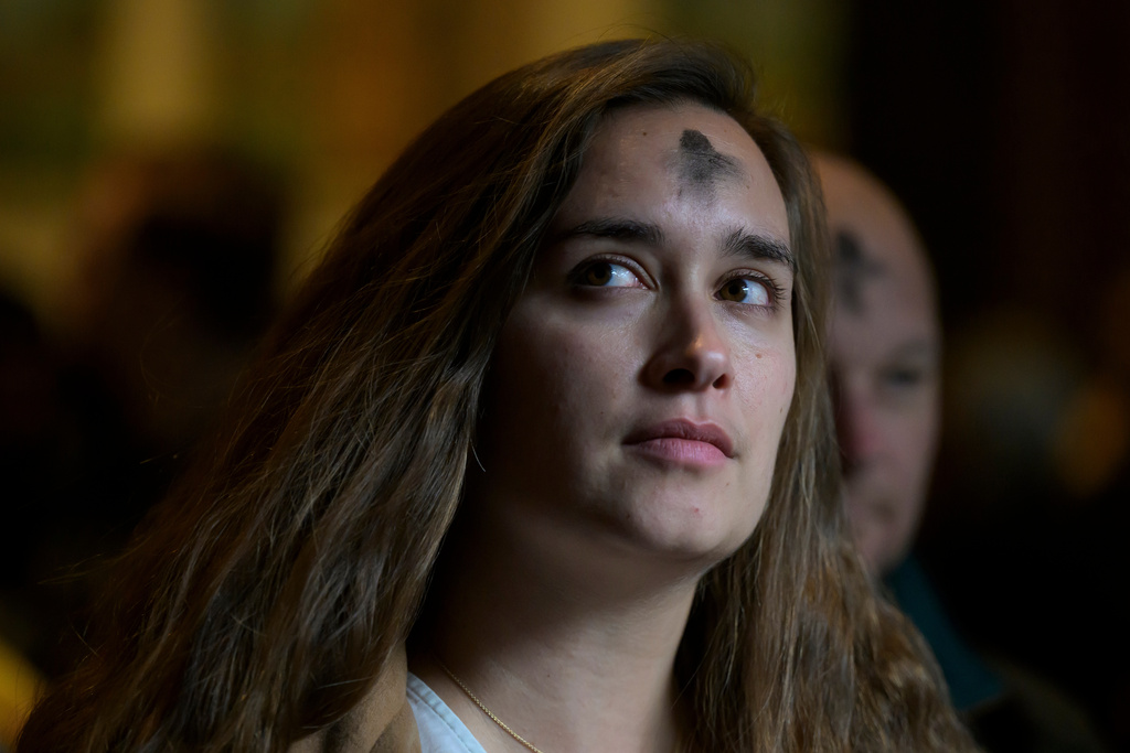 Parishioners depart following an Ash Wednesday Mass at the Cathedral of St. Matthew the Apostle, Wednesday, Feb., 18, 2026, in Washington. (AP Photo/Rod Lamkey, Jr.)