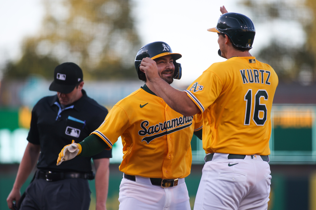 Athletics' Shea Langeliers, second from right, celebrates with teammate Nick Kurtz (16) after hitting a two-run home run during the first inning of a baseball game against the New York Yankees, Saturday, May 30, 2026, in West Sacramento, Calif. (AP Photo/Scott Marshall)