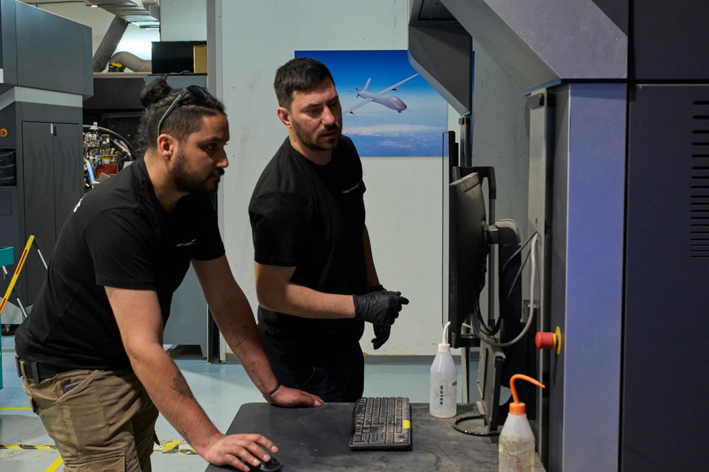 Workers operate a 3D printer that makes drone parts at the headquarters of Masssivit in Lod, Israel, March 30, 2026. (AP Photo/Ohad Zwigenberg)