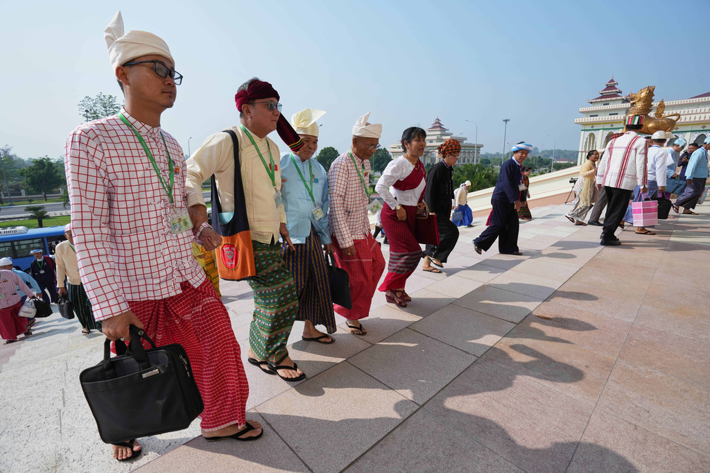 Ethnic lawmakers arrive to attend a session at Union Parliament in Naypyitaw, Myanmar, Thursday, April 9, 2026. (AP Photo/Aung Shine Oo)