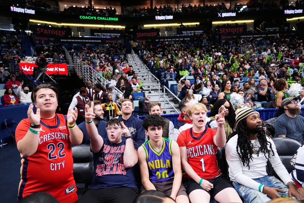 Young New Orleans Pelicans fans react in the second half of an NBA basketball game against the Memphis Grizzlies, Friday, Jan. 30, 2026, in New Orleans. (AP Photo/Gerald Herbert)