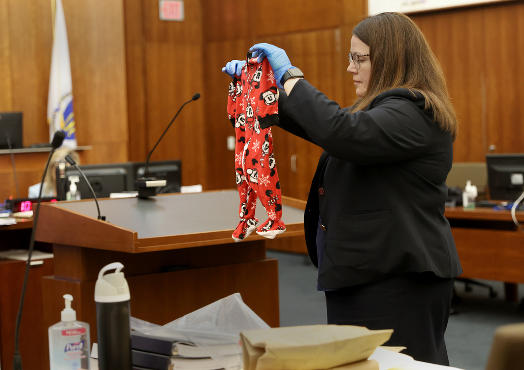 Assistant District Attorney Jennifer Sprague holds up as evidence the pajamas of Callan Clancy during the Lindsay Clancy murder trial at Plymouth Superior Court in Plymouth, Mass., on Wednesday, July 29, 2026. (David L. Ryan/The Boston Globe via AP, Pool)