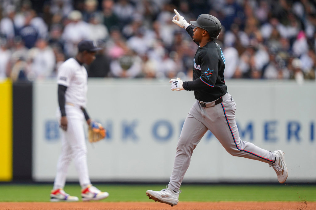 Miami Marlins' Xavier Edwards (9) rounds the bases after hitting a home run during the first inning of the New York Yankees' home-opener baseball game, Friday, April 3, 2026, in New York. (AP Photo/Yuki Iwamura)