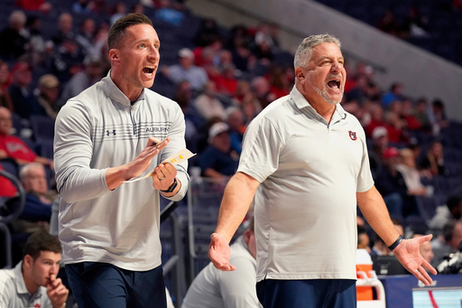 FILE - Auburn head coach Bruce Pearl, right, and his son, assistant coach Steven Pearl, call out to their players during the second half of an NCAA college basketball game against Mississippi in Oxford, Miss., Tuesday, Jan. 10, 2023. (AP Photo/Rogelio V. Solis, File) FILE - Auburn head coach Bruce Pearl, right, and his son, assistant coach Steven Pearl, call out to their players during the second half of an NCAA college basketball game against Mississippi in Oxford, Miss., Tuesday, Jan. 10, 2023. (AP Photo/Rogelio V. Solis, File)