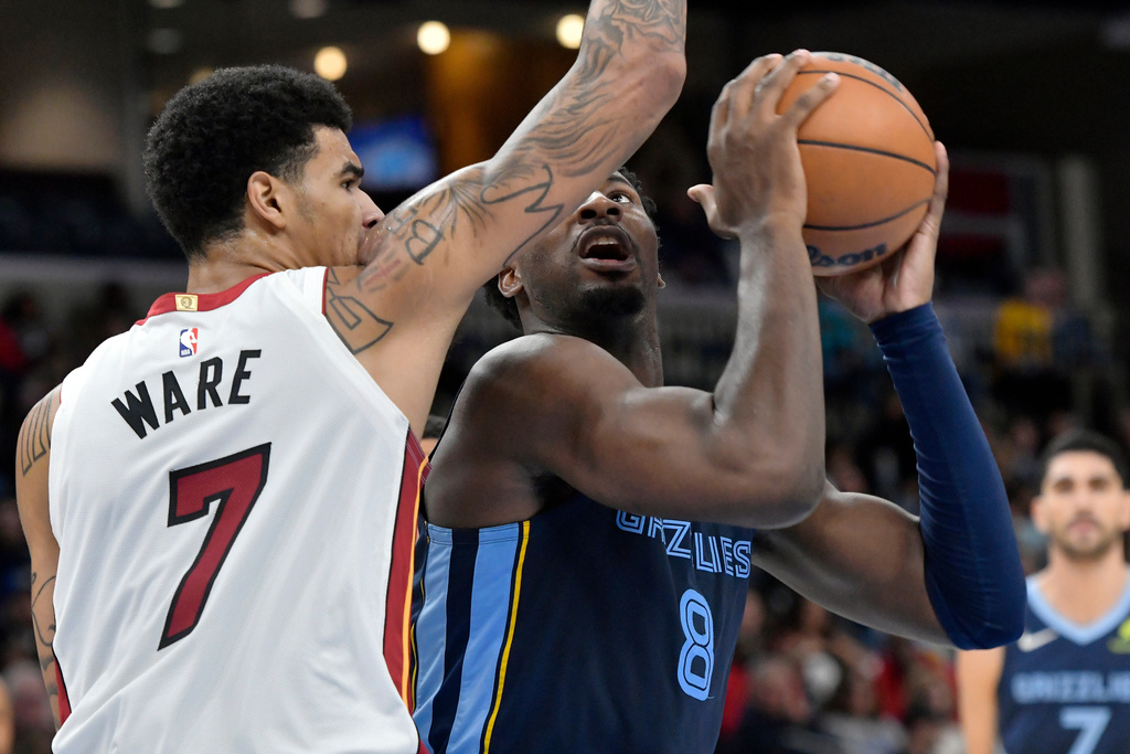 Memphis Grizzlies forward Jaren Jackson Jr. (8) shoots against Miami Heat center Kel'el Ware (7) in the first half of an NBA basketball game Friday, Oct. 24, 2025, in Memphis, Tenn. (AP Photo/Brandon Dill)