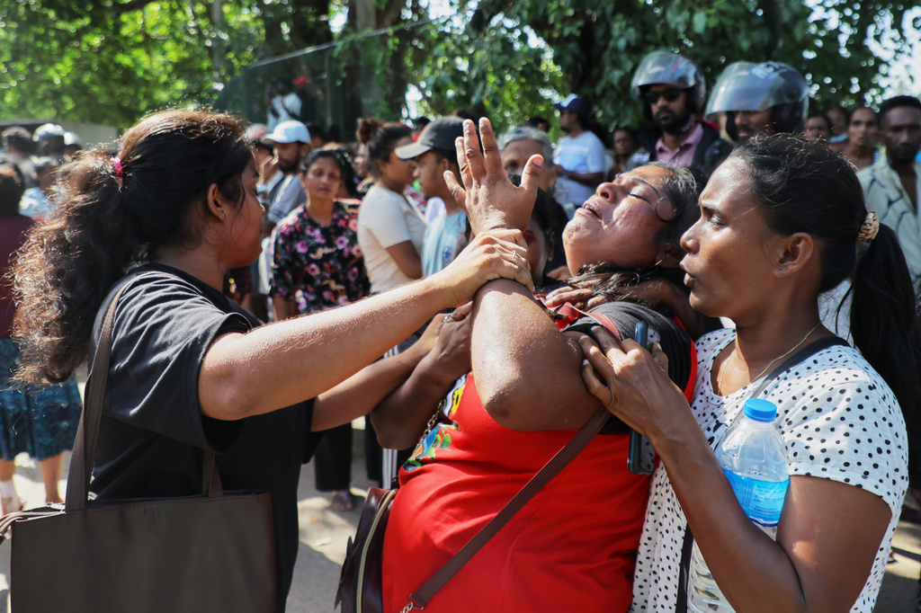 A relative of an inmate breaks down outside a prison where deadly clashes broke out on Sunday, in Negombo, 35 kilometers (22 miles) north of the capital Colombo, Sri Lanka, Monday, July 6, 2026. (AP Photo)
