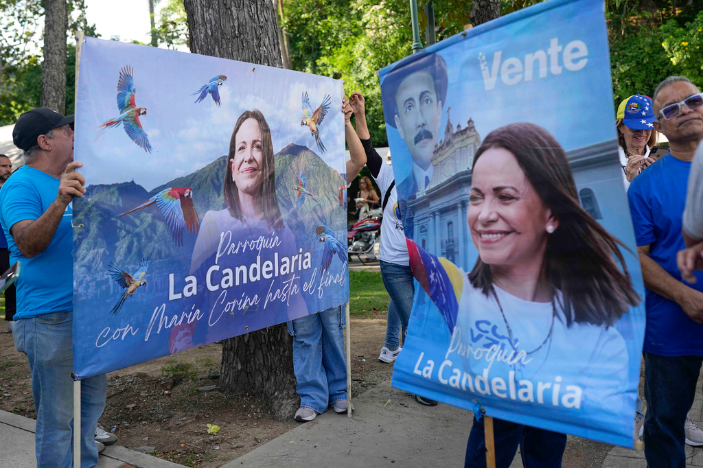 Supporters of opposition leader Maria Corina Machado gather to demand that a date be set for presidential elections in Caracas, Venezuela, Thursday, Oct. 22, 2026. (AP Photo/Ariana Cubillos)