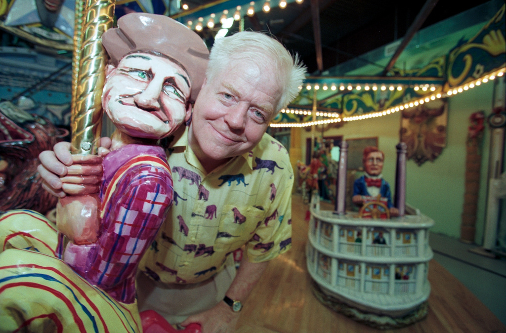 FILE - Artist Red Grooms poses in New York, July 16, 1998, with one of the figures for the Tennessee Fox Trot Carousel he has created for Nashville, his native town. (AP Photo/Suzanne Plunkett, File)