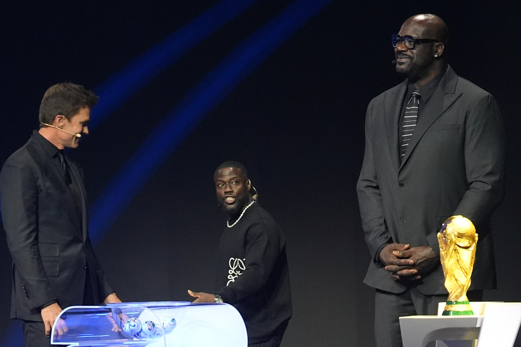 Former NBA player Shaquille O'Neal, actor Kevin Hart and former NFL player Tom Brady attend the draw for the 2026 soccer World Cup at the Kennedy Center in Washington, Friday, Dec. 5, 2025. (AP Photo/Jacquelyn Martin)