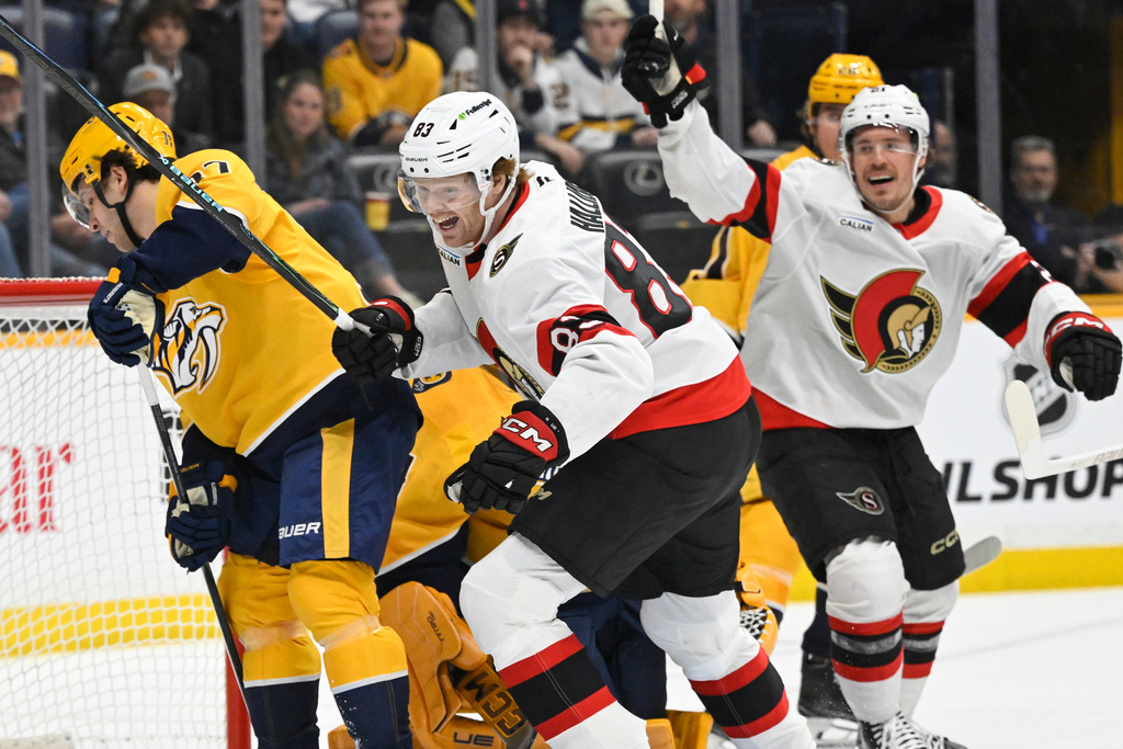 Ottawa Senators' Stephen Halliday (83) reacts along with center Nick Cousins, right, as Nashville Predators defenseman Nick Blankenburg, left, looks away during the first period of an NHL hockey game Thursday, Jan. 22, 2026, in Nashville, Tenn. (AP Photo/John Amis)