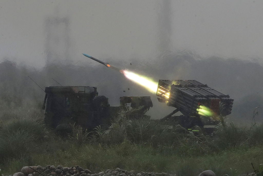 A rocket is fired from a multi-rocket launcher during a military live-fire shooting training in Taichung City, Taiwan, Tuesday, June 9, 2026. (AP Photo/Chiang Ying-ying)