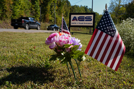 Flowers and flags rest at the entrance to Accurate Energetic Systems after an explosion on Friday, killed 16 people in McEwen, Tenn. Sunday, Oct. 12, 2025. (AP Photo/George Walker IV) Flowers and flags rest at the entrance to Accurate Energetic Systems after an explosion on Friday, killed 16 people in McEwen, Tenn. Sunday, Oct. 12, 2025. (AP Photo/George Walker IV)
