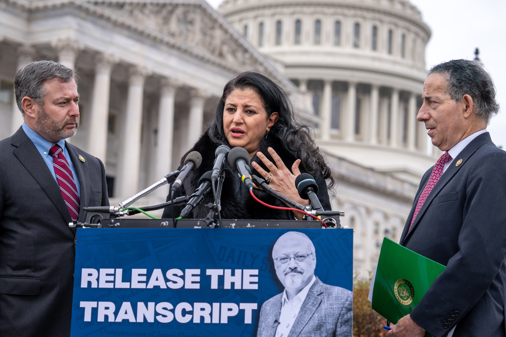 From left, Rep. Eugene Vindman, D-Va., Hanan El-Atr Khashoggi, the widow of slain journalist Jamal Khashoggi, and Rep. Jamie Raskin, D-Md., hold a news conference as they call on President Donald Trump to release the transcript of a call he had with Saudi Crown Prince Mohammed bin Salman after Khashoggi's killing, at the Capitol in Washington, Friday, Nov. 21, 2025. (AP Photo/J. Scott Applewhite)