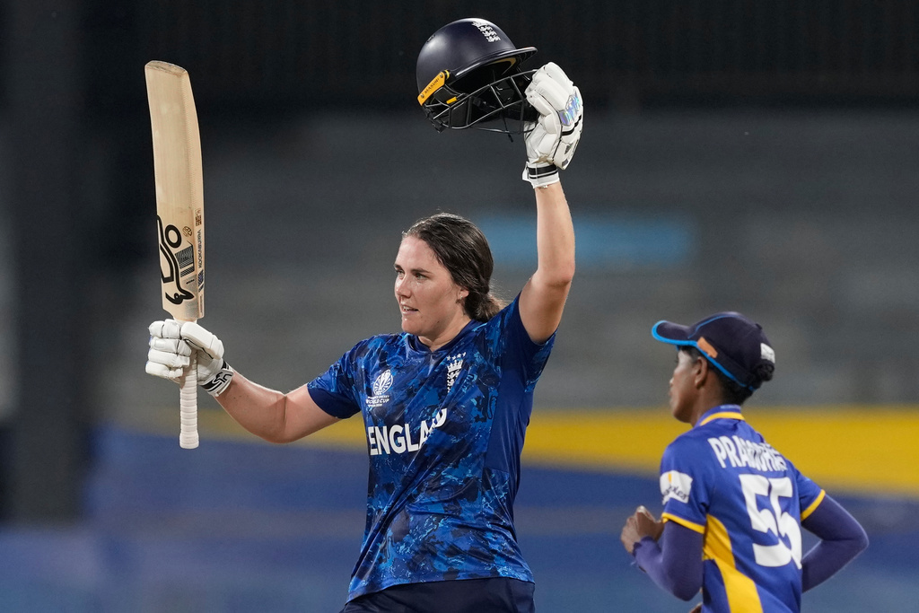 England's captain Nat Sciver-Brunt celebrates her century during the ICC Women's Cricket World Cup match between England and Sri Lanka at Premadasa Stadium in Colombo, Sri Lanka, Saturday, Oct. 11, 2025. (AP Photo/Eranga Jayawardena)