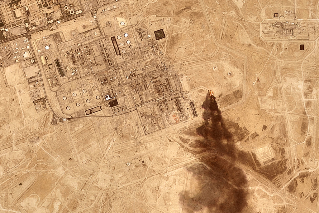 This satellite image provided by Planet Labs PBC on July 27, 2026 shows smoke rising from the Saudi Aramco oil processing facility in Abqaiq, Saudi Arabia, 2026. (Planet Labs PBC via AP)