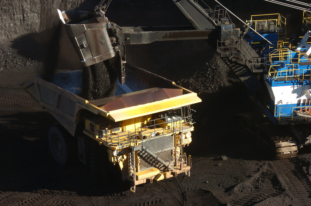 A mechanized shovel loads coal into a haul truck at the Spring Creek mine, in this Nov. 15, 2016 photo, near Decker, Mont. (AP Photo/Matthew Brown)
