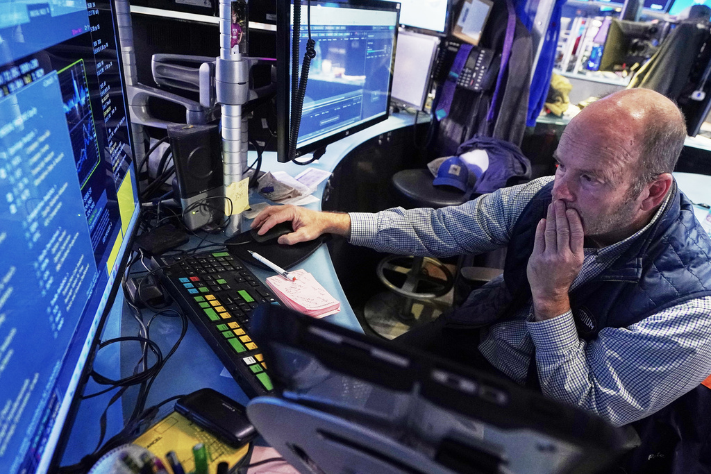 Trader Peter Mancuso works on the floor of the New York Stock Exchange, Wednesday, Nov. 12, 2025. (AP Photo/Richard Drew)