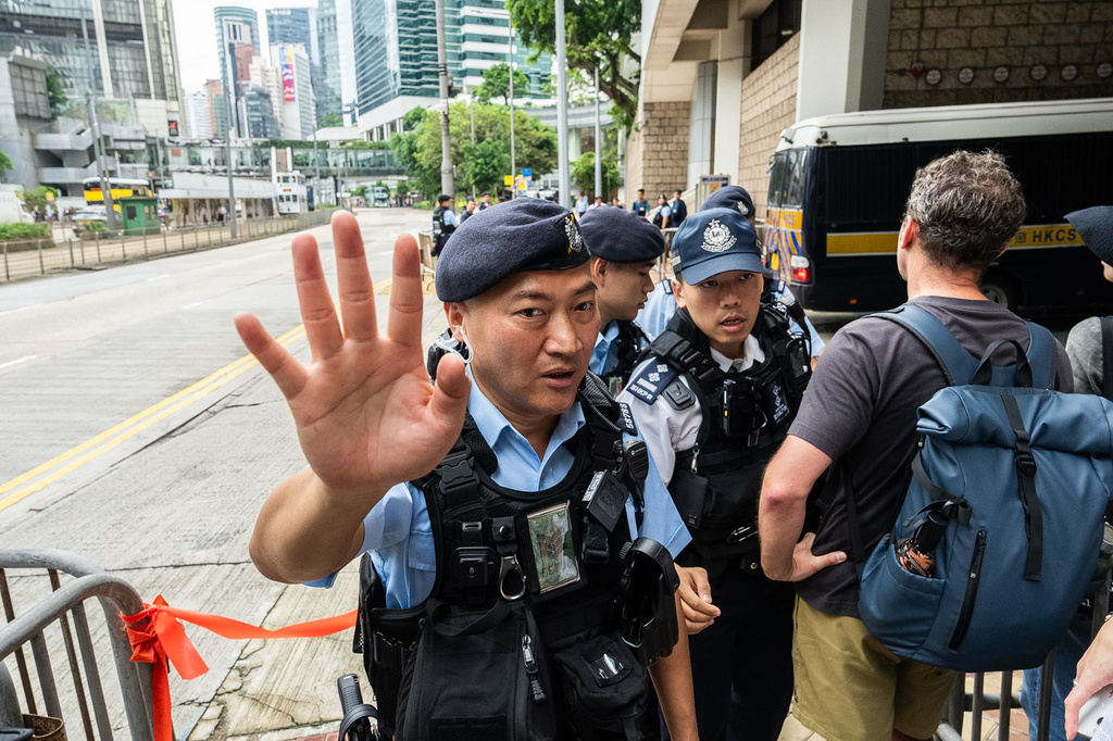 Police officers stand guard outside the High Court in Hong Kong, Wednesday, Sept. 2, 2026. (AP Photo/Chan Long Hei)